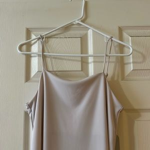 Small H&M cream satin slip dress. Cut slit and calf length. Barely used.